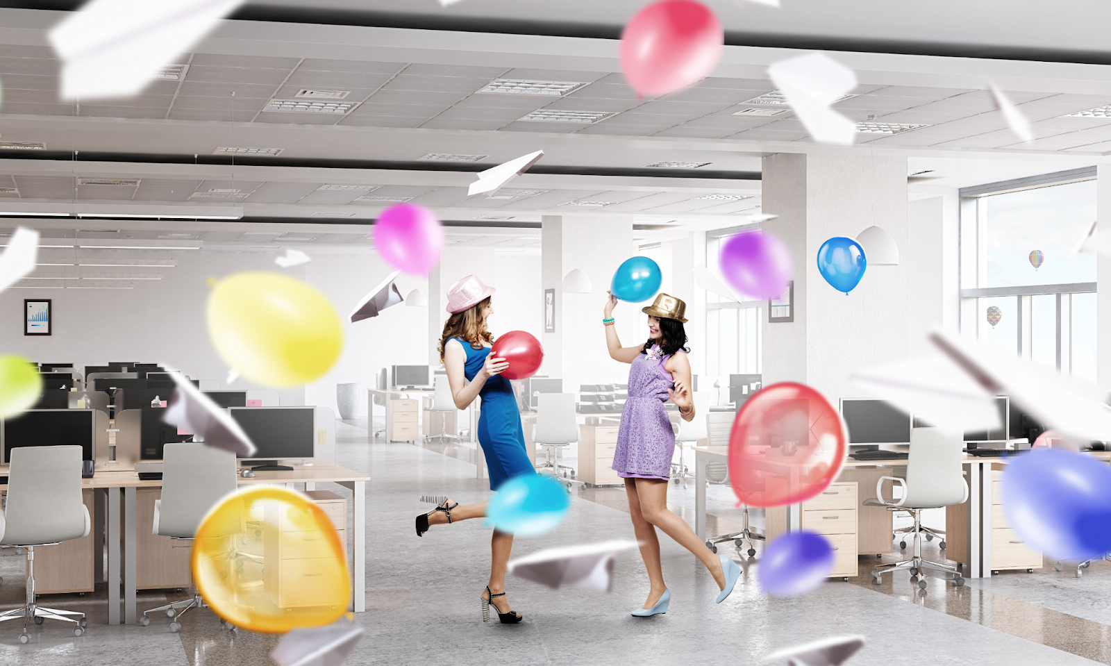 two girls tossing beach ball