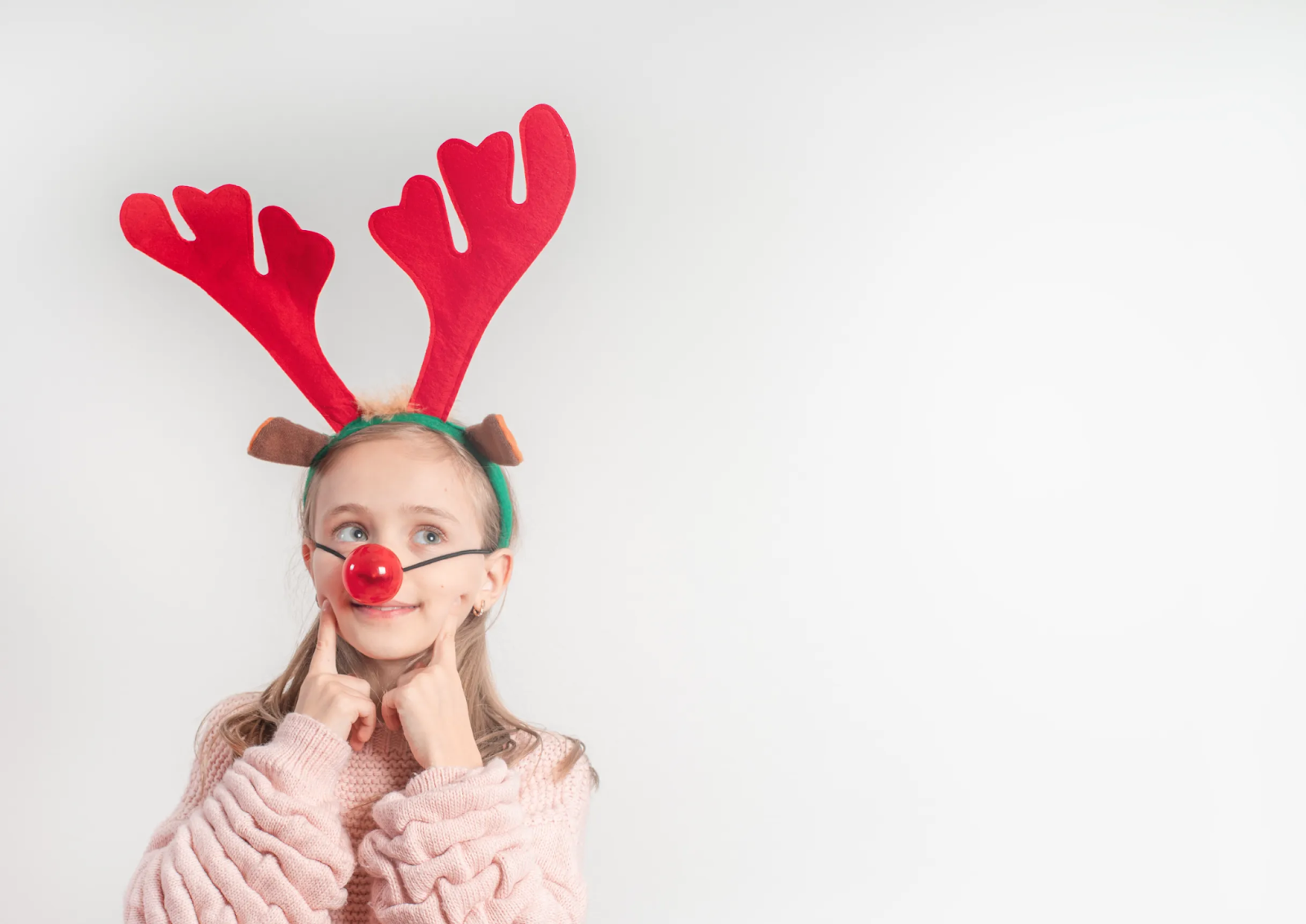A girl with rudolph headband