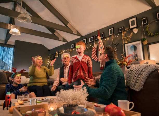 Family playing game and cheering at Christmas Holiday