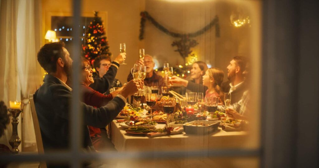 Family Dinner, raising glass as they celebrate the party