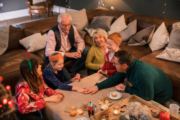 Family Gathering and playing game happily at Christmas