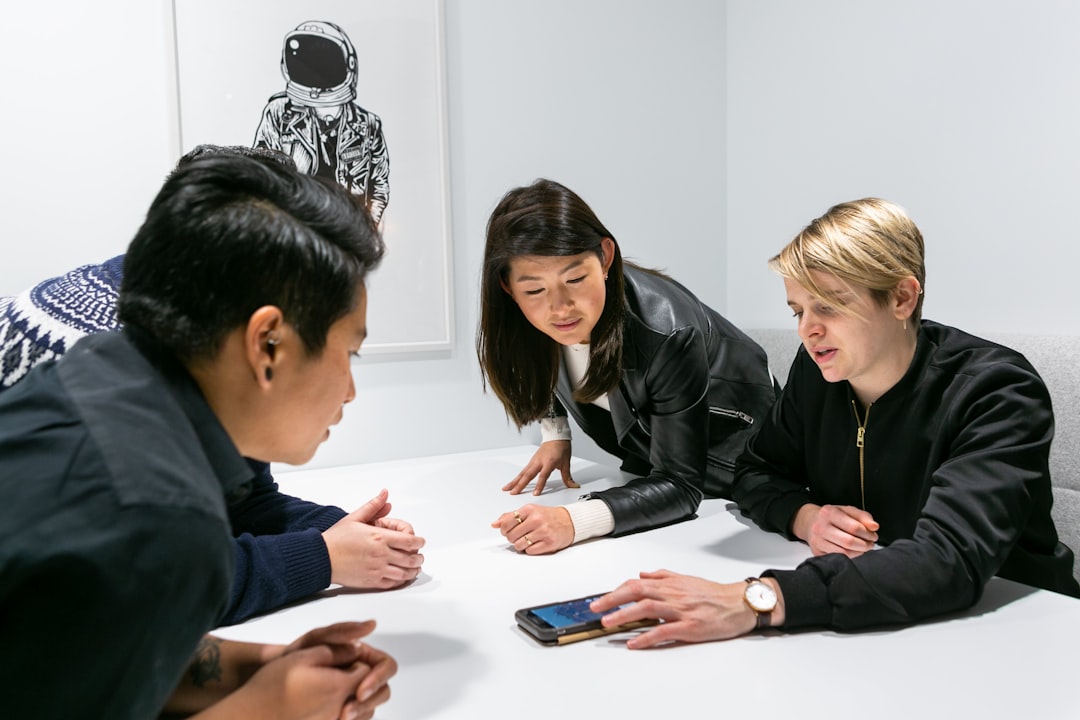 Team collaborating on app development in a meeting room