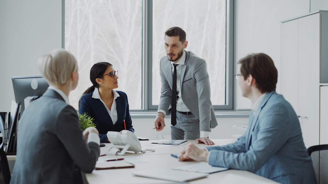Business professionals in a meeting around a table