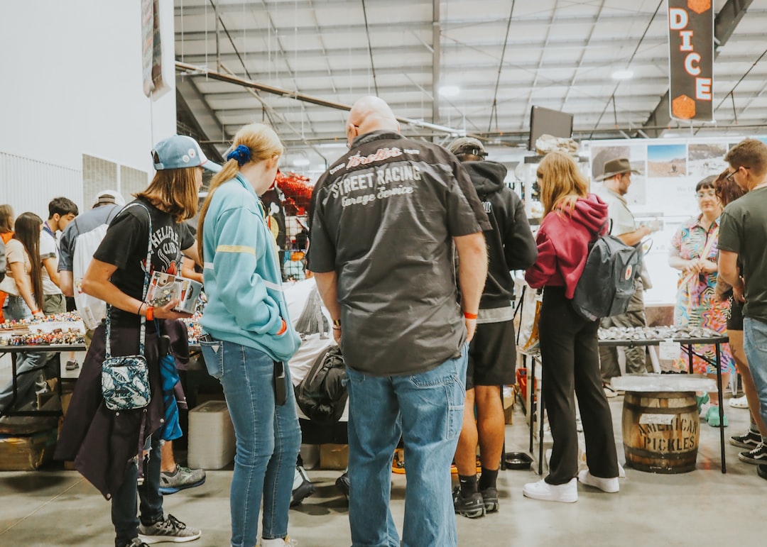 Attendees networking and exploring booths on a busy trade show floor
