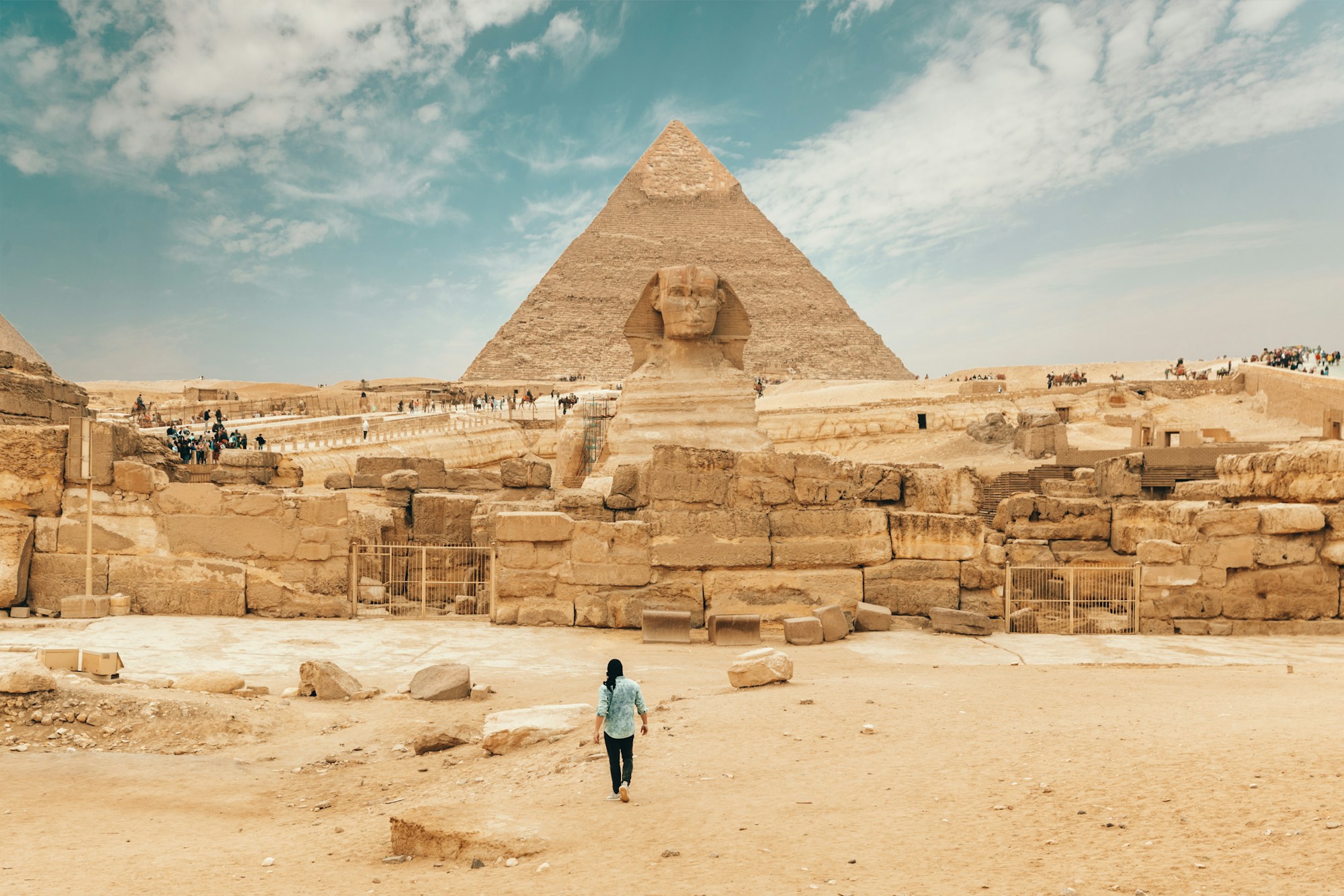 Tourists exploring a historic city street with a map. Photo by Annie Spratt on Unsplash