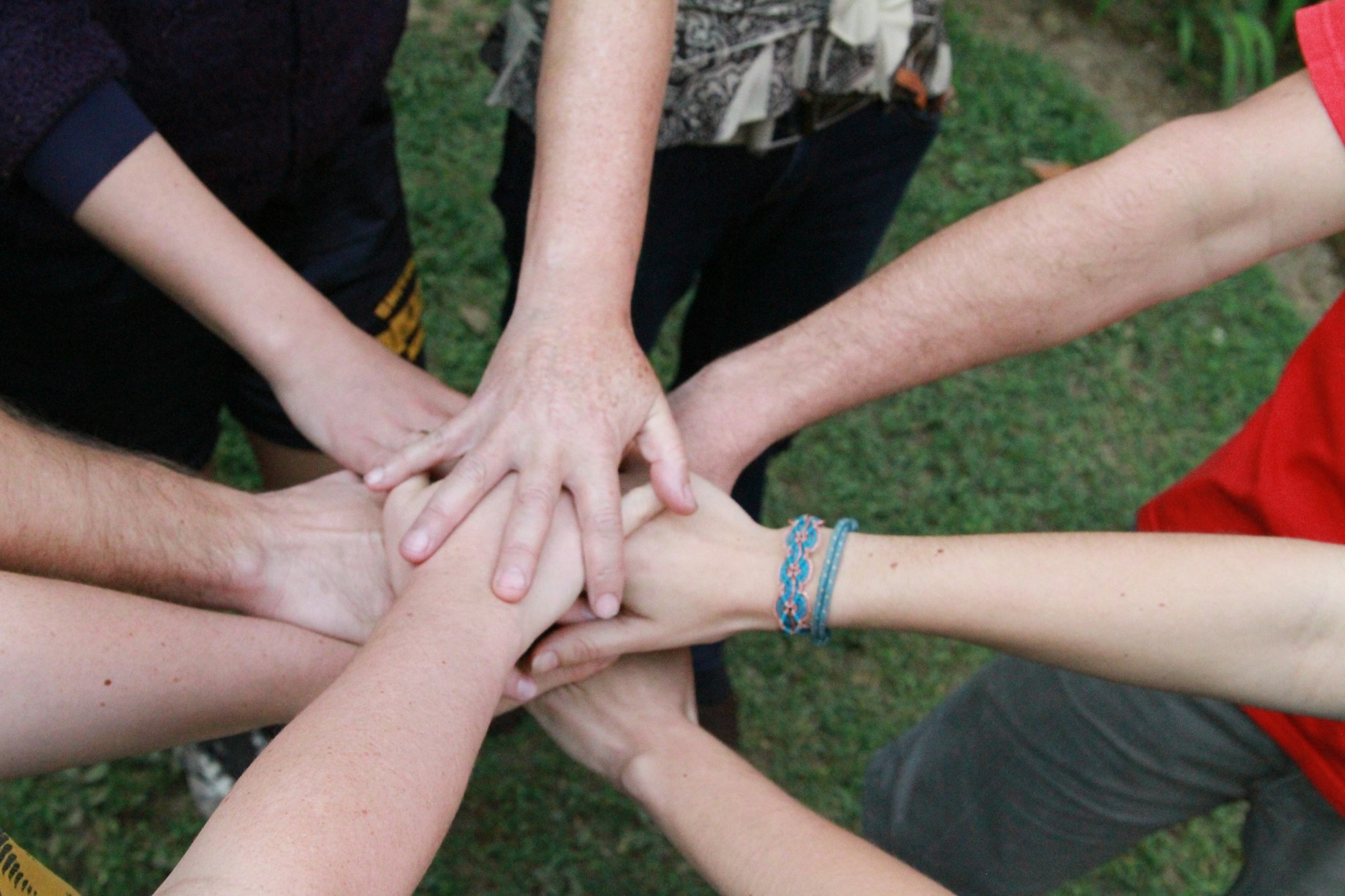 Team putting hands together during a group activity